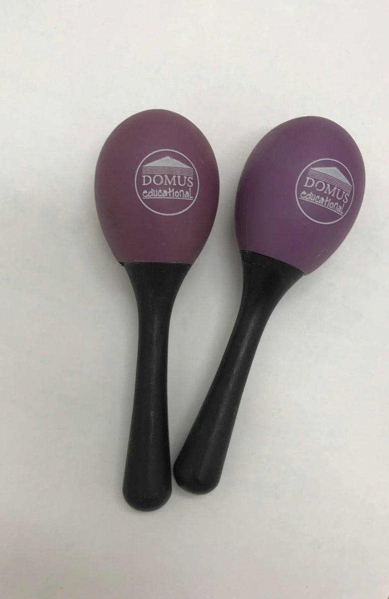 Maracas in plastica a forma di uovo con manico.